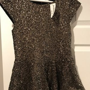 NWT- Sequin peplum blouse.